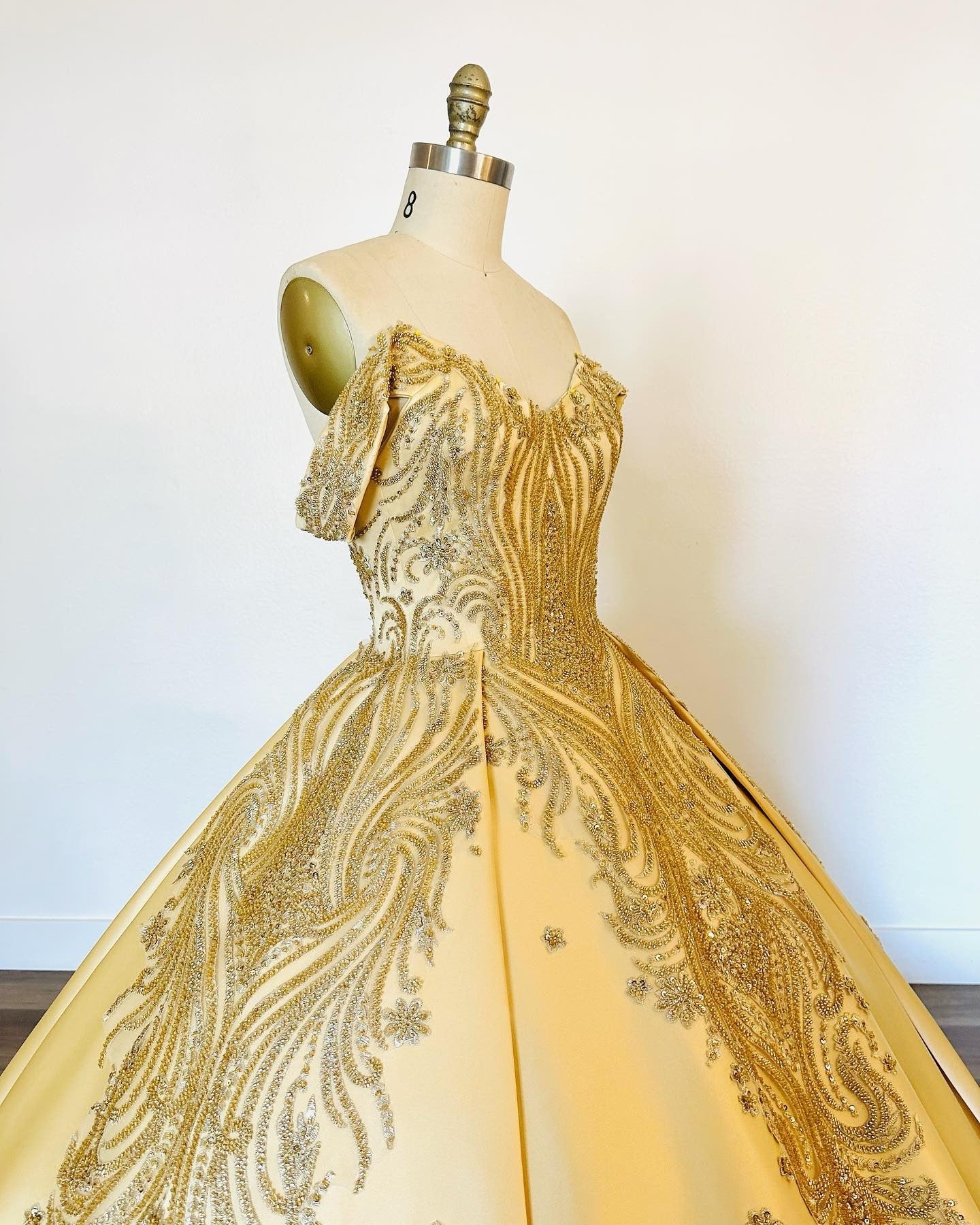 Gold Satin Quinceanera Dress Off-Shoulder Ball Gown with Intricate Appliques for Sweet 16