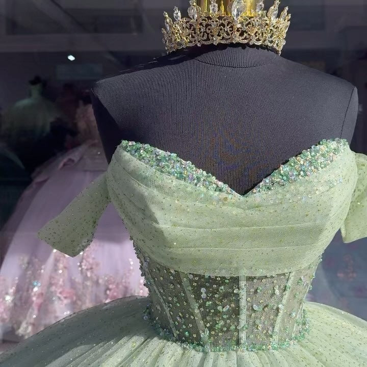 Sage Green Off-Shoulder Ball Gown with Beaded Detailing & Glitter Tulle Skirt Perfect for Quinceanera Sweet 16 and Formal Evening Events
