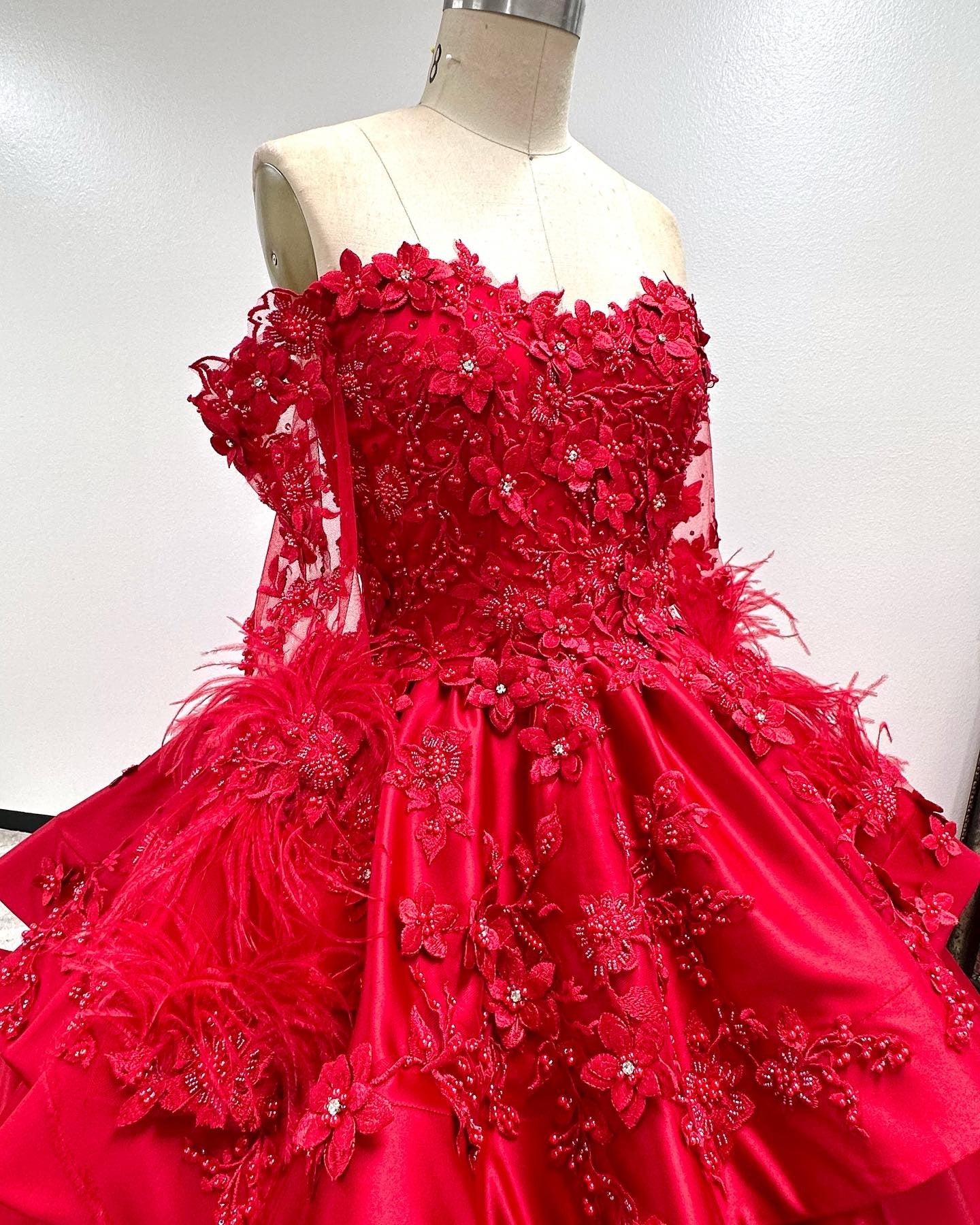 Off-Shoulder Long Sleeve Red Satin Quinceanera Dress with Floral Lace Appliques Perfect for Sweet 16 Celebrations