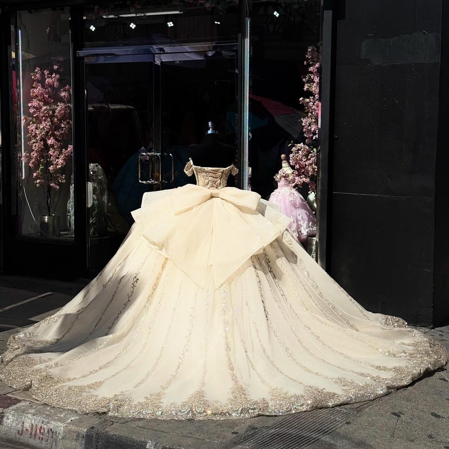 Champagne Gold Beaded Ball Gown Off-Shoulder Sleeveless Quinceanera Dress with Tulle Skirt & Bow Detail for Sweet 16 Birthday & Formal Events