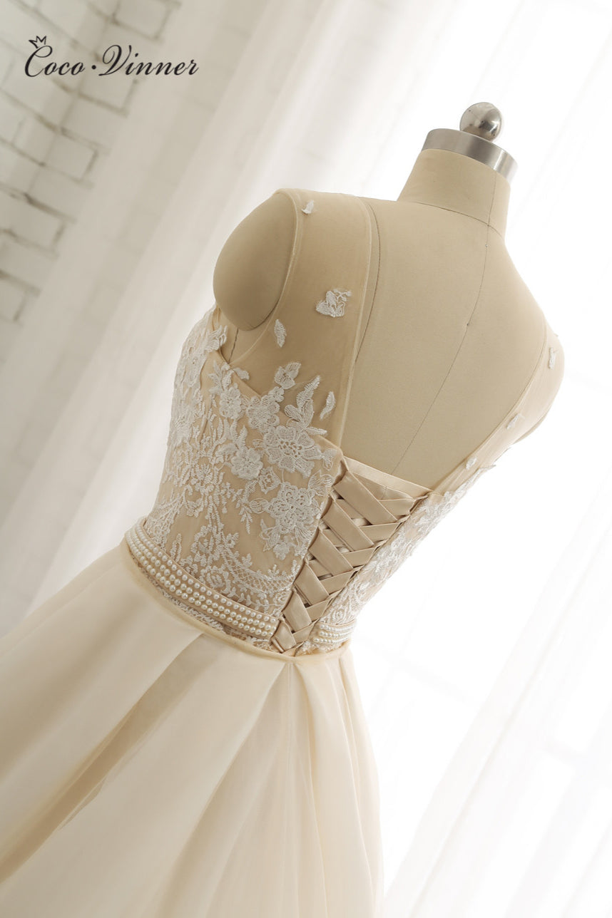 Glamorous Jewel Tulle Champagne Wedding Dress Appliques Sleeveless Overskirt Bridal Gowns with Beading Sash Online